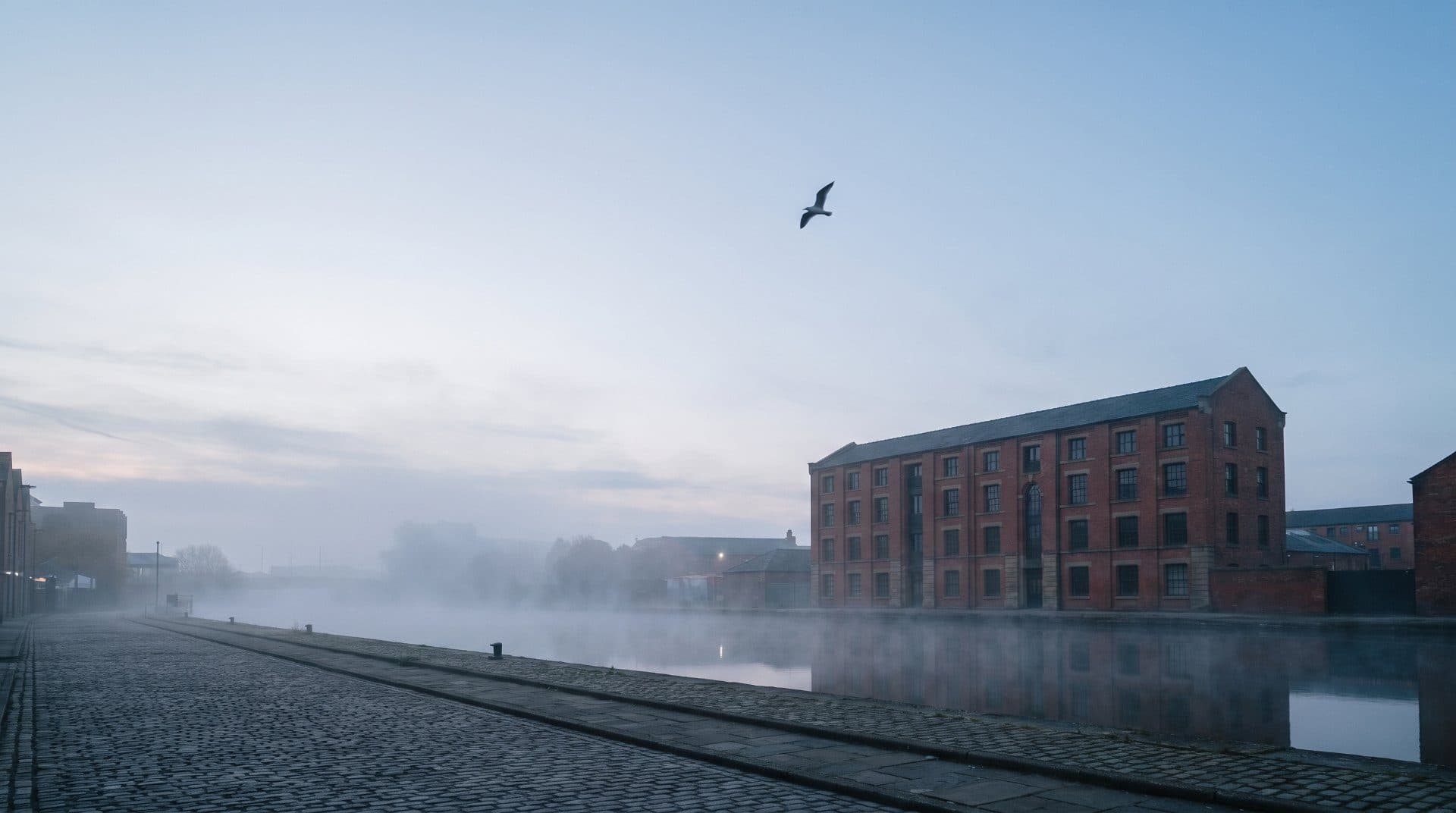 North Quay Works at dawn, in mist by the canal.